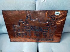 A worked Copper wall plaque of a Tudor house signed indistinct 79. 55cm x 36cm.