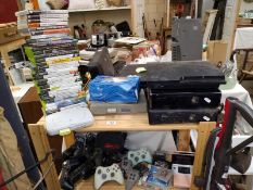 A large selection of gaming. 2 PlayStation 1's, games, a PS3, 2 Xbox 360's, 3 Nintendo DS's, DS
