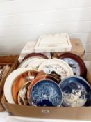 A box of collectors plates with boxes