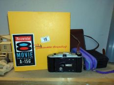 An unboxed Brownie 8 movie projector & a quantity of camera's COLLECT ONLY