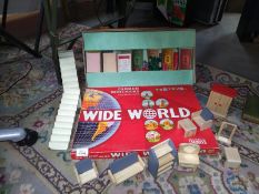 An old vintage Monopoly A/F a wide world game and wooden dolls house furniture