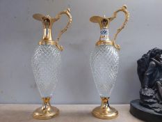 A pair of gilt metal mounted claret jugs (Height 39cm) COLLECT ONLY