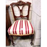 A reupholstered Victorian chair