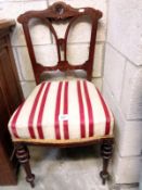 A reupholstered Victorian chair