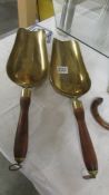 Two Brass grain scoops.