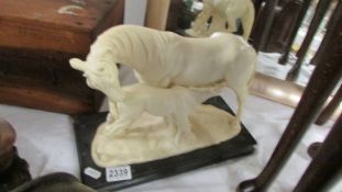 A horse and foal figure.