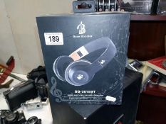 A boxed Bose booster BB-301 5 BT wireless, over ear headphones