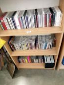 3 shelves of talking books and cd sets