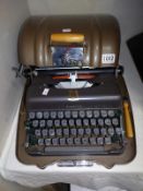 A vintage 'Good Companian 3' cased typewriter. COLLECT ONLY