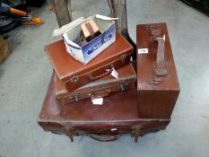 A set of 3 vintage suitcases, a wooden case and retro case wheels.