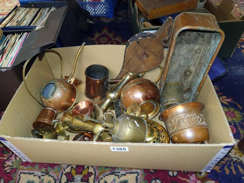 A selection of brass and copper items including planters, watering can etc