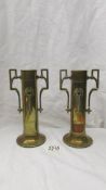 A pair of Art Nouveau brass vases.