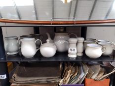 A Denby teapot, milk and sugar, 6 cups, 3 mugs and salt and pepper pots.