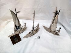 A set of 3 metal sailing boats, height 17cm and a PDYC silver medallion