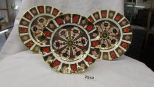 Three Royal Crown Derby Old Imari pattern plates.