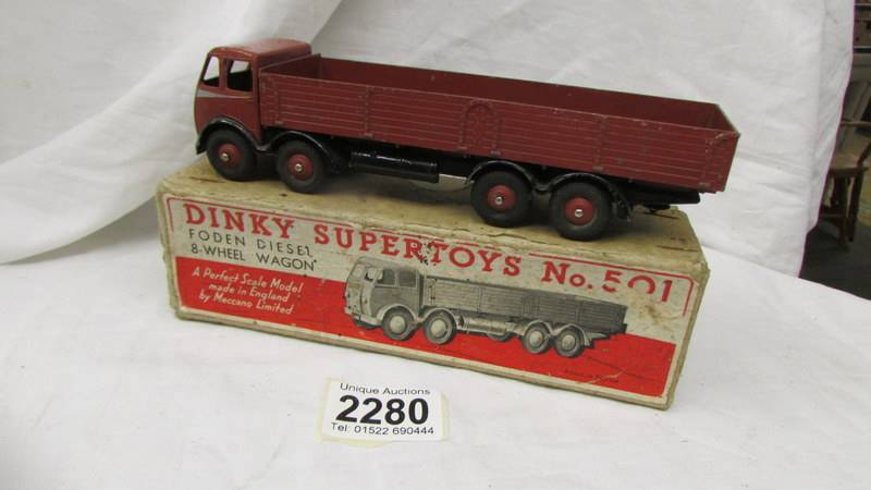 A Dinky 501 boxed eight wheel wagon in brown.