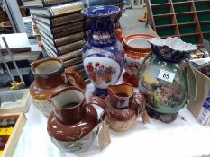 A quantity of stoneware jugs including Doulton A/F