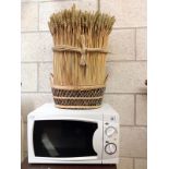 A 700 Watt microwave and a bakers display basket.