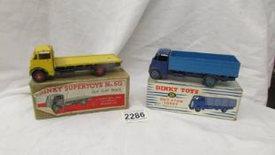 A boxed Dinky 511 and 512 Guy lorry and flat truck.