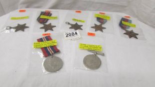 Two WW2 medals and five stars.