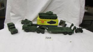 A boxed Dinky 651 Centurion tank and other military vehicles.