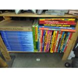 A shelf of 70's 80's and 90's annuals and a set of Disney "World of Knowledge"