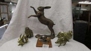 A rampant hare, two brass rabbits, a brass pig, a brass dog and a fox.