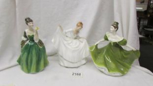 Three Royal Doulton figurines - Fleur HN2368, Pamela HN2479 and Lynne HN2329.