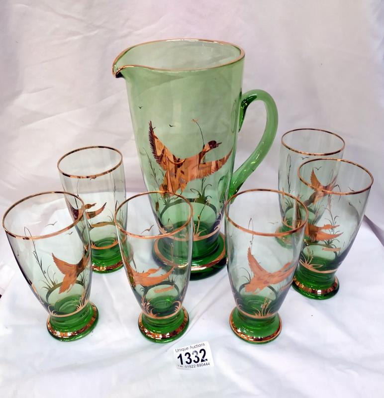 A lovely vintage German green glass drinks set with jug and 6 glasses gold overlaid with flying