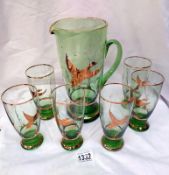 A lovely vintage German green glass drinks set with jug and 6 glasses gold overlaid with flying