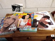 A selection of magazines and books including football, comics, FHM, Mondo