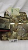 A mixed lot of old coins and bank notes.