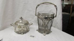 An art nouveau ice bucket with later glass liner and an art nouveau lidded sugar bowl.