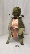 An unusual arts and crafts copper and brass oil lamp.