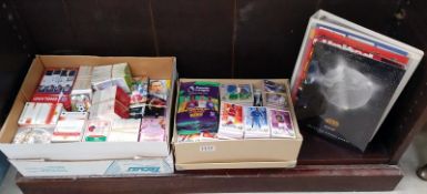 A large quantity of football trading cards and folders of cards