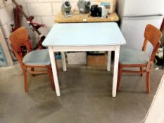 A retro kitchen table and 2 chairs