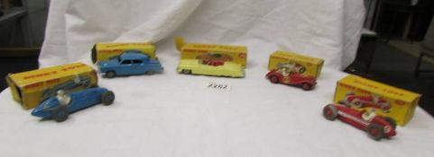 Five boxed Dinky toys including MG, Maserati, Cadilac etc., boxes a/f.