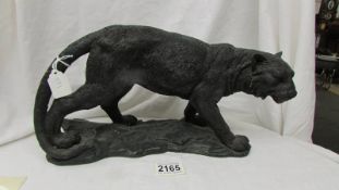 A resin figure of a big cat.