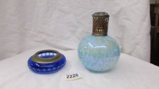 A large irridescent glass perfume bottle (missing stopper) & a blue overlaid cut glass dish