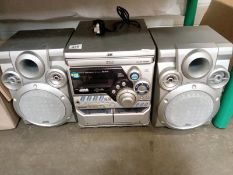 A JVC stereo CD/Tape/receiver HiFi. 3CD changer model A-MXK1R)