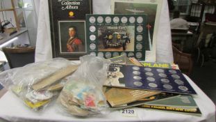 A quantity of motoring coins, stamps etc.,