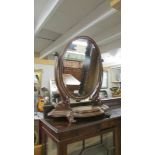 An oval Victorian mahogany toilet mirror. COLLECT ONLY.