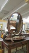 An oval Victorian mahogany toilet mirror. COLLECT ONLY.