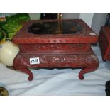 An oriental cinnabar lacquered stool. 36 x 31 x 25.5 cm high. A/F