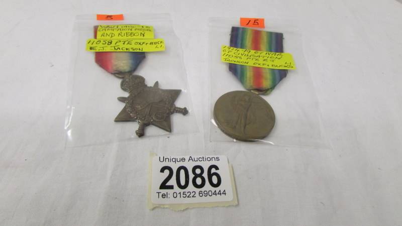 A WW1 medal and star for 11058 Pte E J Jackson, Oxford and Bucks.