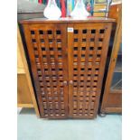 A dark stained pine wine/bottle cabinet COLLECT ONLY
