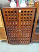 A dark stained pine wine/bottle cabinet COLLECT ONLY