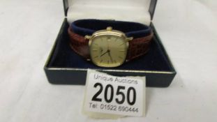 A gold plated manual Longines wrist watch in working order.