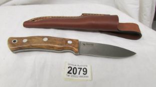 A vintage Swedish hunting knife in sheath,
