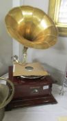 A horn gramaphone with brass horn, in working order. COLLECT ONLY.